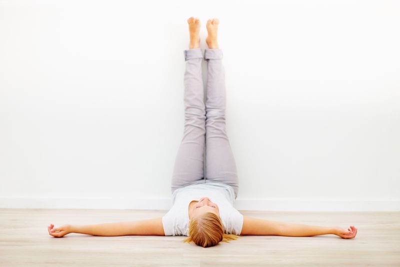 Yoga pose. Legs up the wall 